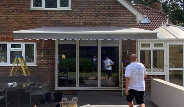 Intelroll Awnings Installation and fitting service commercial and residential in UK checking wall