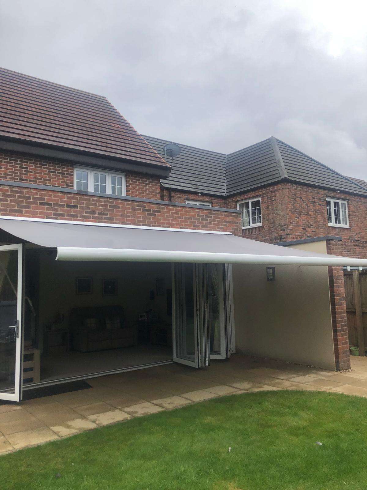 Intelroll Retractable Awnings INT500 grey fabric white frame 3.5m width front view opened 01 Bristol Bath Intelroll Retractable Awnings INT500 grey fabric white frame 3.5m width front view opened 01