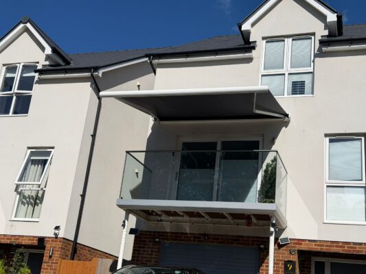 INT500 SHADOW GREY AWNING OPEN ON BALCONY. SHADOW VIEW IN SUNNY WEATHER TN2 3YJ