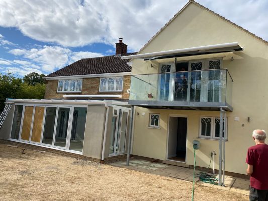 Retractable awning, balcony, white frame full cassette Cambridge delivery installation service. 3