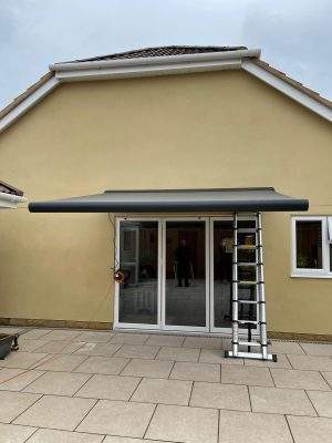 Intelroll, Motorised retractable awning, grey frame, grey frame, popular choice, patio, installation