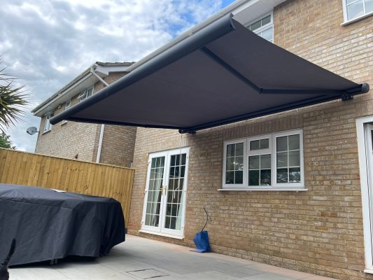 PUGrey awning patio shading solution and installation service UK HR6 Retractable arms Intelroll canopy