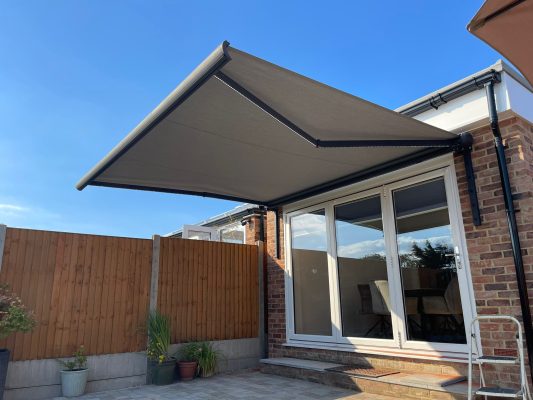 Silver grey canopy patio shading solution Intelroll awning UK SY13