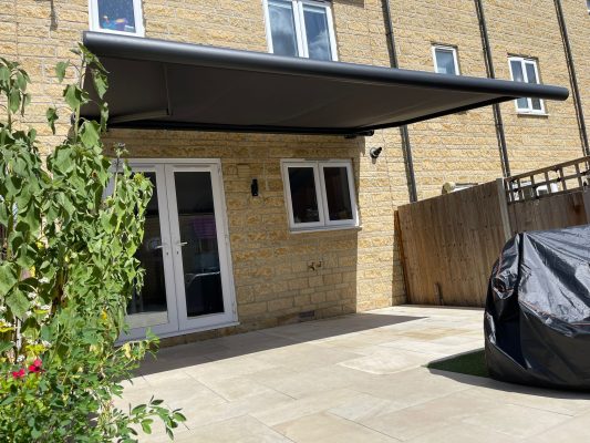 Garden patio awning with electric remote control by Intelroll LD3
