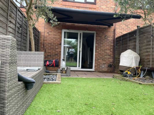 Manual retractable awning canopy for garden shading by intelroll global limited in the UK Wales NP7