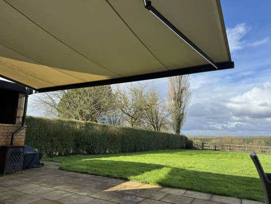 INT500 full cassette patio awning, grey frame, Acrylic creme fabric with LED lights, St Albans