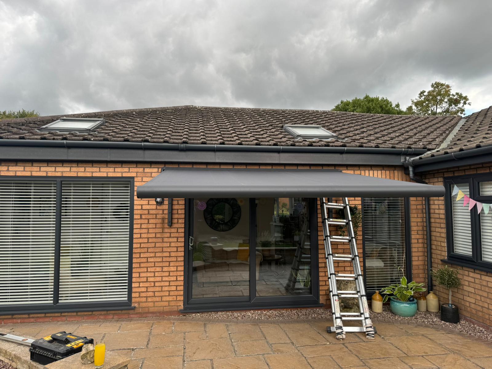 WhatsApp Image 2024-09-13 at 14.29.12 INT500 Full cassette patio awning electric with grey frame awning installation Warrington