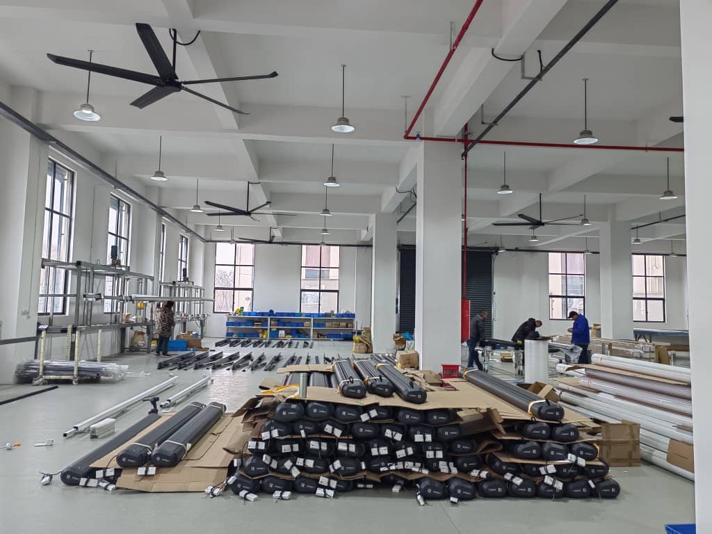 warehouse Intelroll retractable awnings in manufacturing stage stocking on the floor, 2026 colour grey cassette