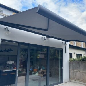 Spreader Bracket - Standard Stright installed on Intelroll Awnings retractable for wall colour grey black
