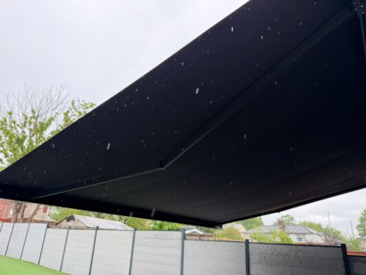 TENNYSON RD, MIDDLETON M24 2WS INT 500 GREY COLOUR OPENED AWNING RAINY DAY 19TH MAY 2026